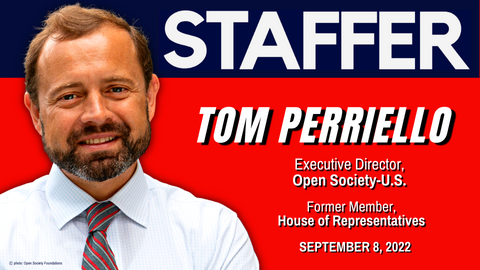 Tom Perriello with red and blue STAFFER background.