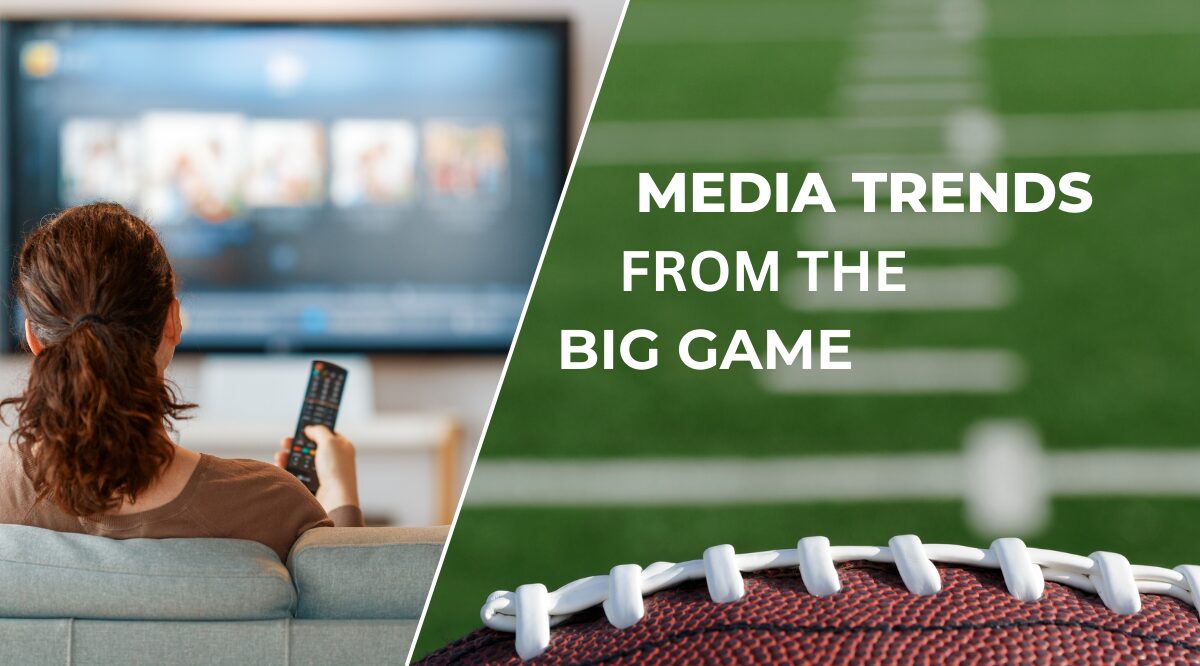 Person watching the Super Bowl on a TV screen showing a football play.